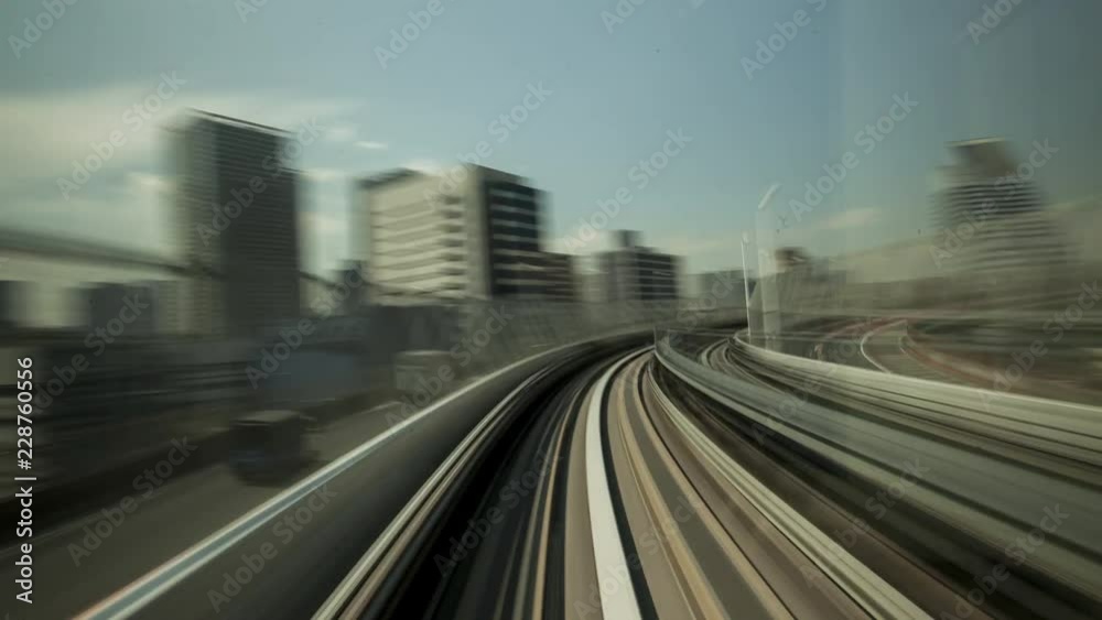 Time Lapse of train moving through city at day, Tokyo, Japan Time Lapse of train moving through city at day, Tokyo, Japan