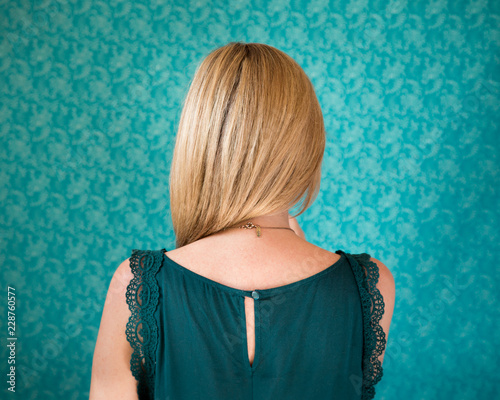 Reverse portrait - the back of a blond woman's head