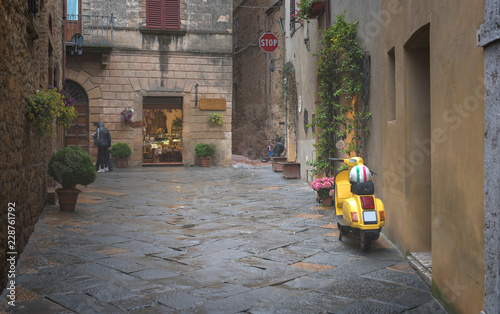 Bike parked on the Colorful street in Pienza, Tuscany, Italy