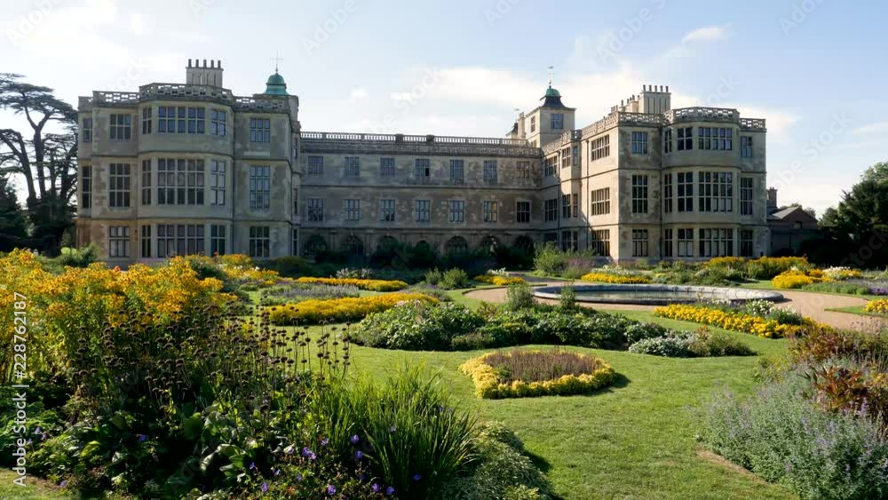 Breeze stirs garden plants at Audley End a Jacobean mansion house in Essex, England one of the grandest non-palace houses in all of England with beautiful garden to match the grandeur of the house.