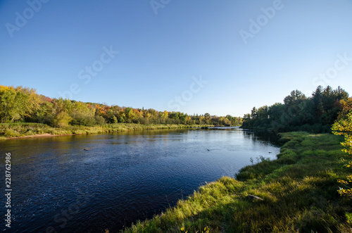 Kettle River in Banning State Park Minnesota during a sunny autumn day photo