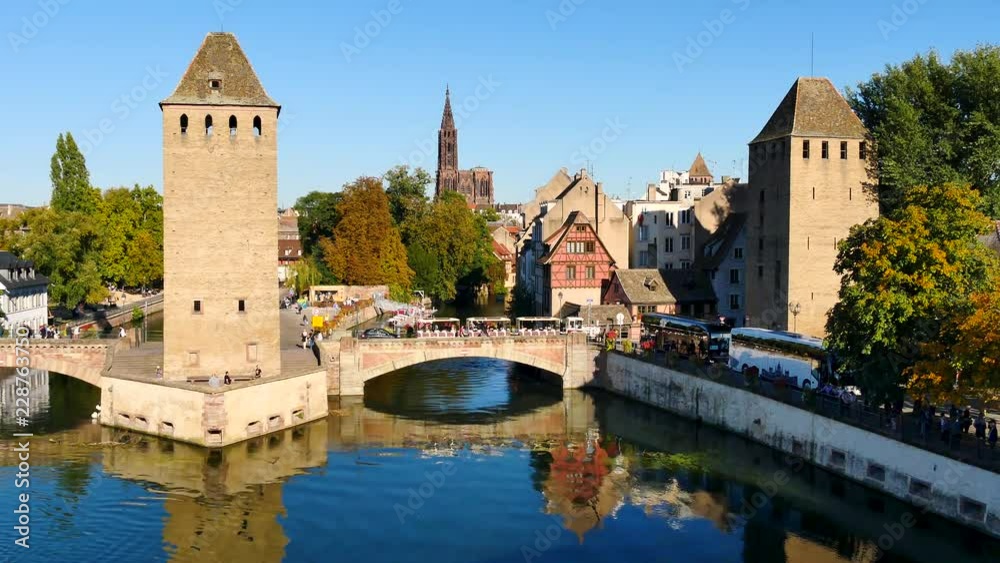 Les Ponts Couverts (covered bridges, in english) over the Ill River in the heart of Little France (old district of the city) in Strasbourg. In the background, there is the cathedral. Les Ponts Couverts (covered bridges, in english) over the Ill River in the heart of Little France (old district of the city) in Strasbourg. In the background, there is the cathedral.