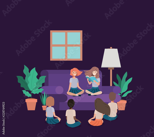 students sitting in the livingroom reading book