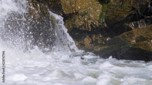 Waterfall and rocks on river Vydriha near village Belovo in Novosibirsk region,  Russia photo