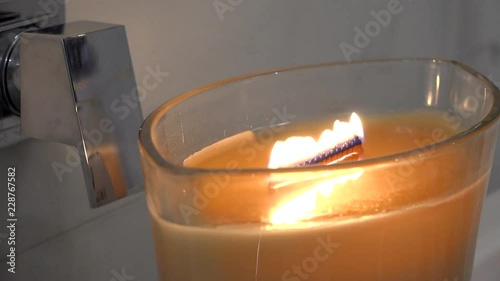 Tight shot of lighting a candle photo