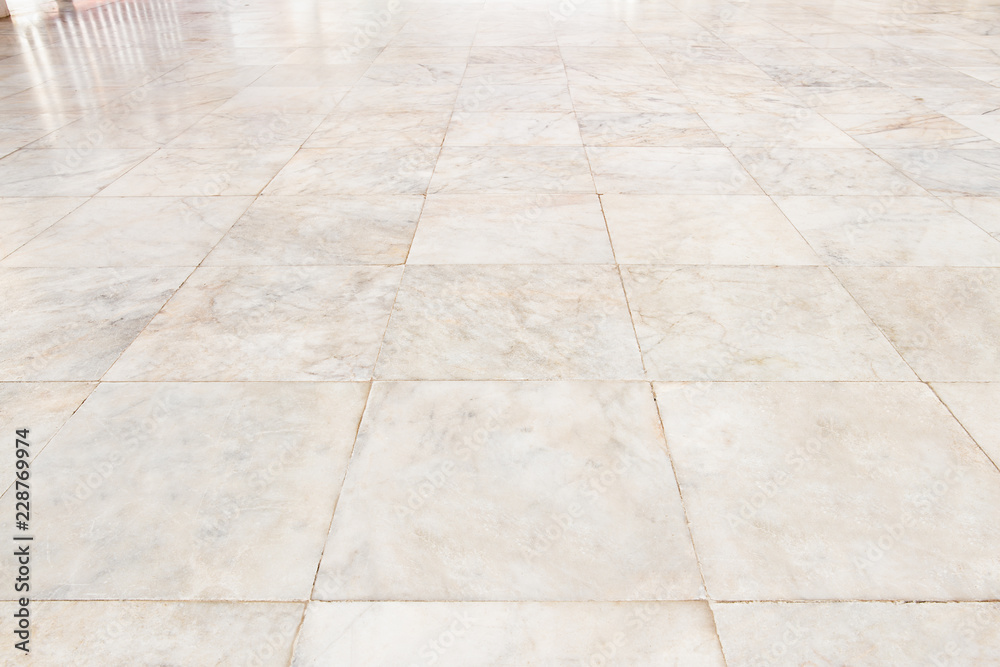 Real marble floor tile in perspective with beige abstract texture pattern of nature material i.e. stone, rock. Smooth surface for decorative wall, floor of interior building i.e. bathroom, kitchen. Real marble floor tile in perspective with beige abstract texture pattern of nature material i.e. stone, rock. Smooth surface for decorative wall, floor of interior building i.e. bathroom, kitchen.