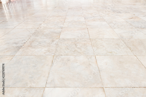 Real marble floor tile in perspective with beige abstract texture pattern of nature material i.e. stone, rock. Smooth surface for decorative wall, floor of interior building i.e. bathroom, kitchen.