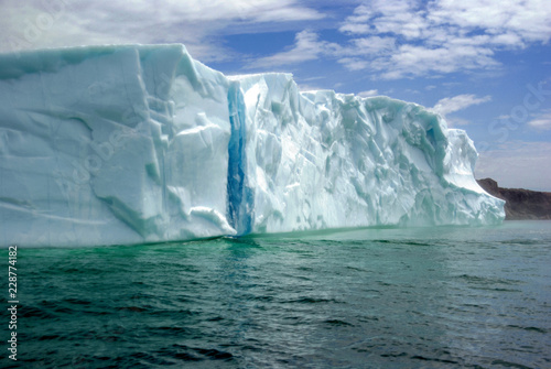 Large Floating Iceberg With Blue Glacier Ice Stripe © leene50