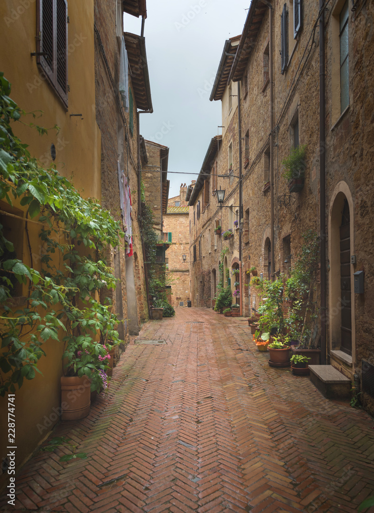 Beautiful and colorful streets of the small and historic Tuscan village Pienza, Italy
