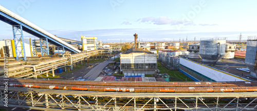 The territory of an industrial enterprise. Fuel and oil tanks. Interlacing of huge, industrial pipes in the factory. Power station. Panorama. Russia