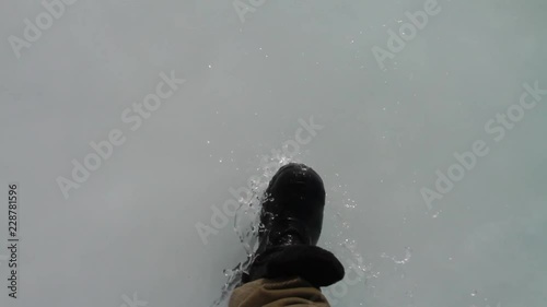 Boots walking on ice photo