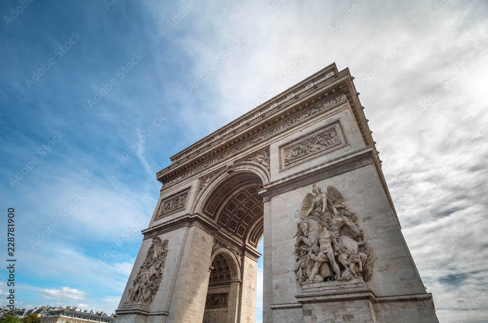Looking up to the Arc de Triumph in a Bright Sunny Day in Paris