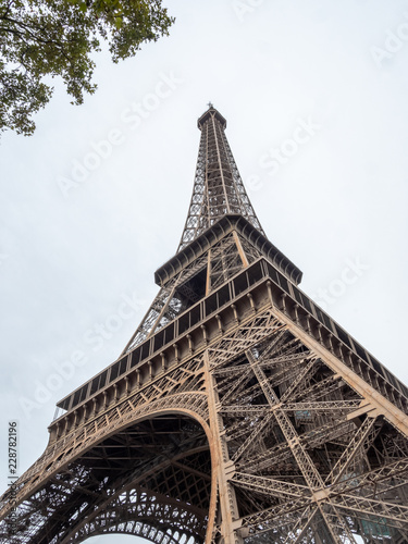 Looking up the Paris Eiffel Tower With Cloudy Skies