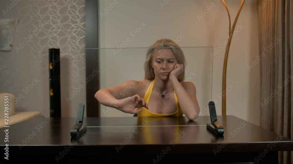 Sexy attractive lady work with transparent glass computer display. She looks very hot and handsome. Touchscreen. 4k ultra HD footage. Static. Ready for Your infographics content Sexy attractive lady work with transparent glass computer display. She looks very hot and handsome. Touchscreen. 4k ultra HD footage. Static. Ready for Your infographics content
