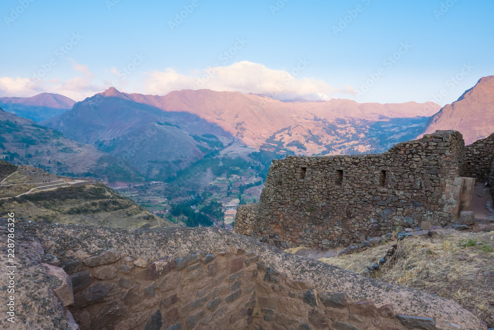 ancient buildings Inca archaeological site of Pizac at sunset