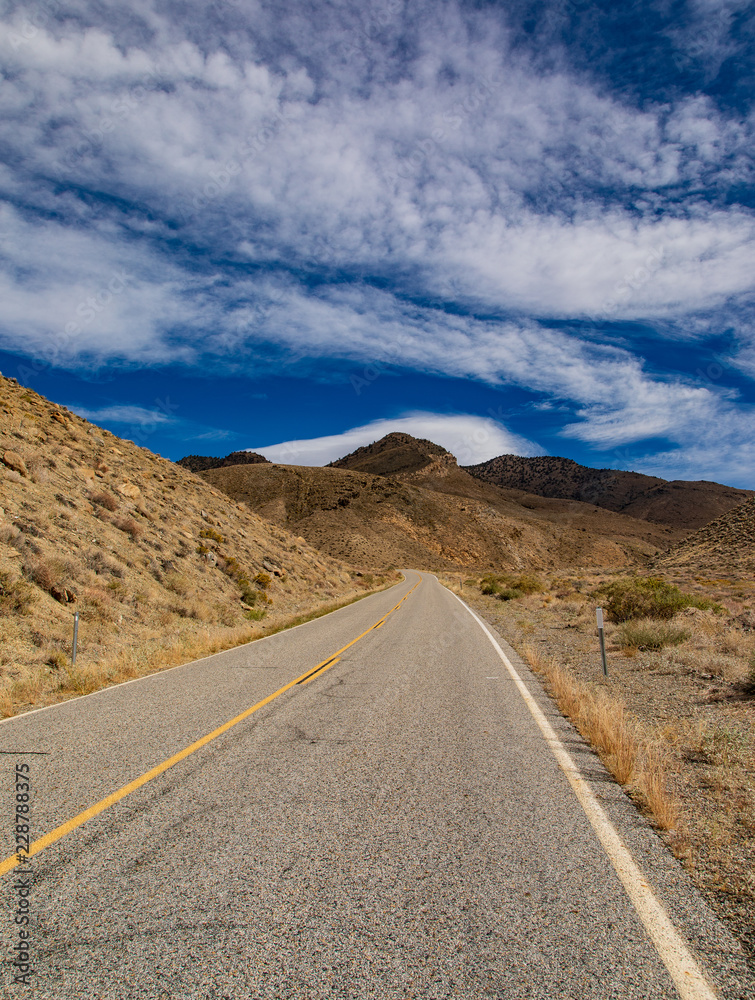 Highway 89 over the sierra heading up to the mountain and clouds Highway 89 over the sierra heading up to the mountain and clouds