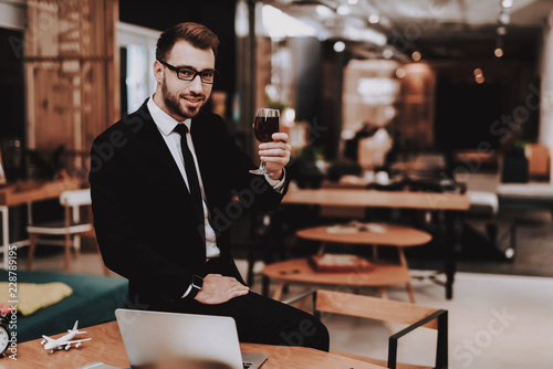 Sit. Glass of Wine. Business Suit. Brainstorm.