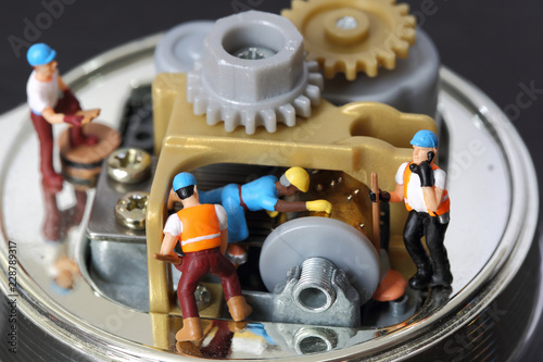 Selective focus of miniature engineer and worker fixed and repair musical box and use for business background.