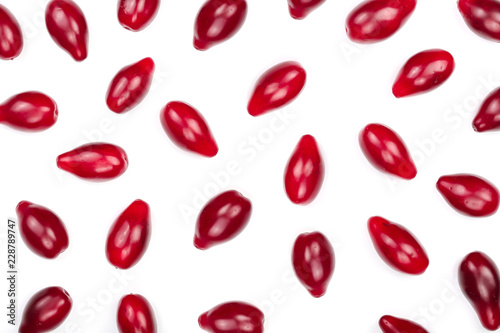 Red berries of cornel or dogwood isolated on white background. Top view. Flat lay