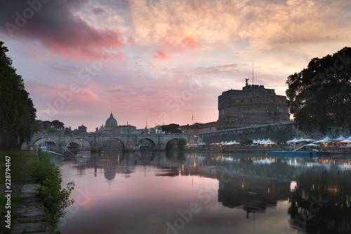 Vatican City, Rome, Italy, Beautiful Vibrant Night image Panorama of St. Peter's Basilica, Ponte St. Angelo and Tiber River at Dusk in Summer. Reflection of The Papal Basilica of St. Peter