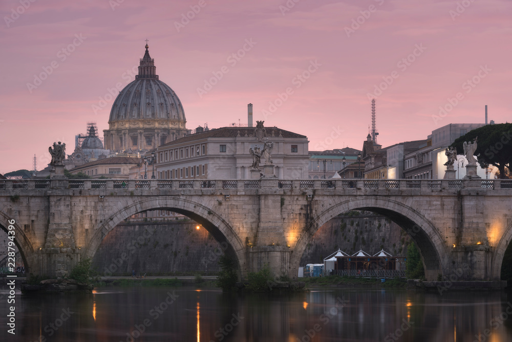 Fototapeta premium Vatican City, Rome, Italy, Beautiful Vibrant Night image Panorama of St. Peter's Basilica, Ponte St. Angelo and Tiber River at Dusk in Summer. Reflection of The Papal Basilica of St. Peter