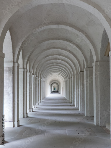 Marble arches disappearing into the distance