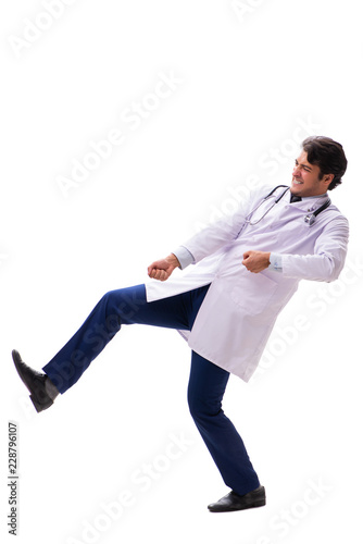 Young handsome doctor under pressure isolated on white