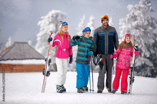 skiing -family enjoying in winter vacation in mountains