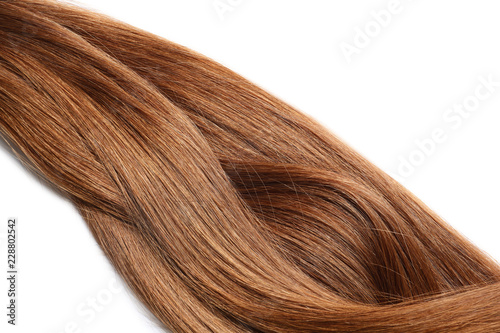 Locks of healthy red hair on white background