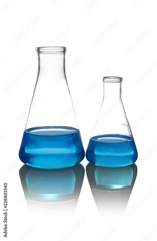 Conical flasks with liquid on table against white background. Laboratory analysis Conical flasks with liquid on table against white background. Laboratory analysis