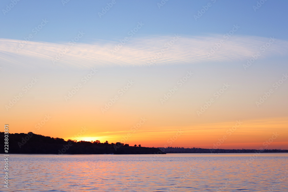 Picturesque view of beautiful sunset on riverside