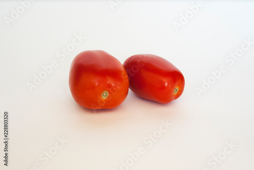 red tasty tomatoes on white background