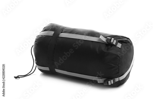 Sleeping bag in case on white background. Camping equipment