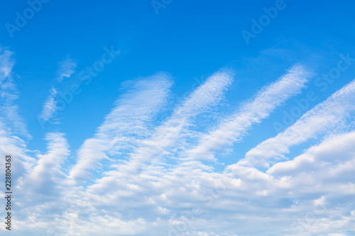 Fototapeta Naklejka Na Ścianę i Meble -  blue sky with clouds shaped as spread fingers