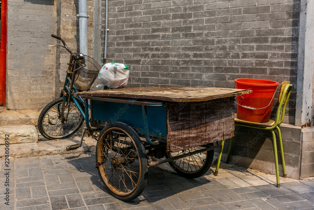 Vintage bike in the narrow alley in a traditional Beijing Hutong in China - 1