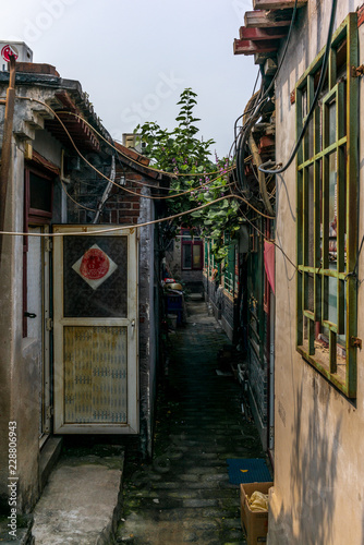 A view of a narrow alley in a traditional Beijing Hutong in China - 5 photo