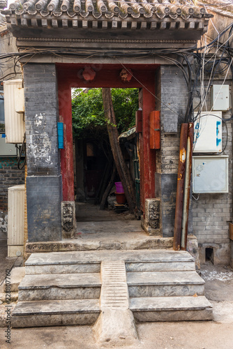 A view of an entrance of a courtyard in a traditional Beijing Hutong in China - 4