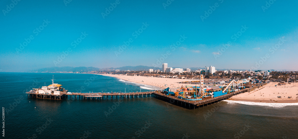 Aerial view on the Santa Monica amusement park with roller coaster and  ferris wheel near Venice beach in Los Angeles, California. Stock Photo |  Adobe Stock