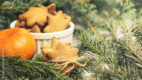 Gingerbread Cookie. Small stars. Delicious tangerine. Fir branch. NewYear