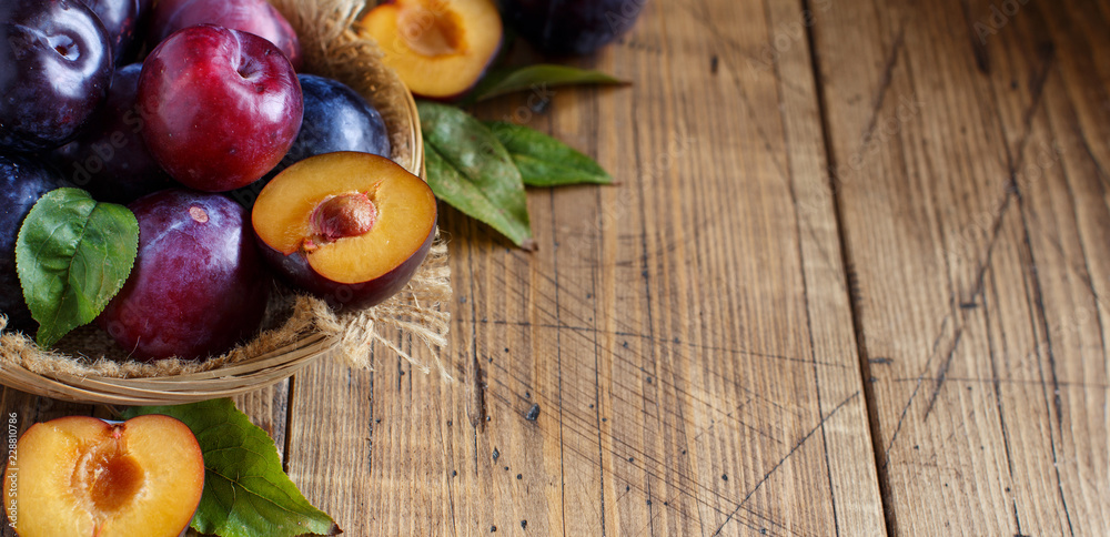 Fresh plums with leaves Fresh plums with leaves