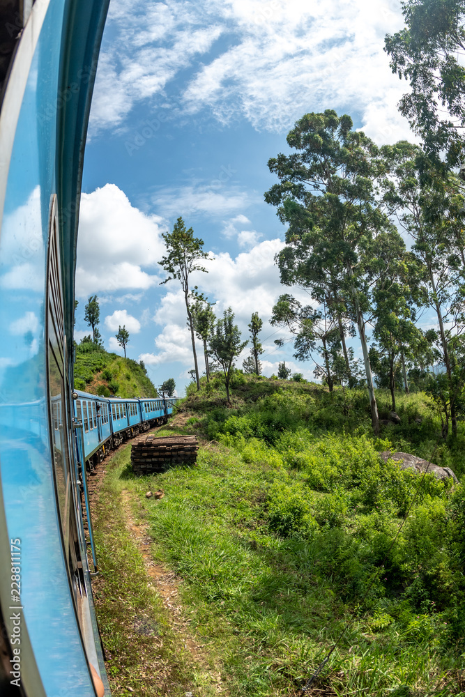 Train journey through scenic highlands of Sri Lanka. 