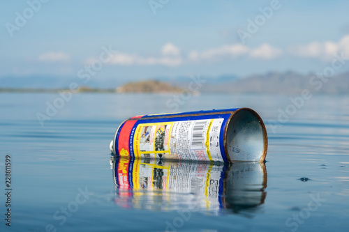  Metal spray can floating at the surface  photo