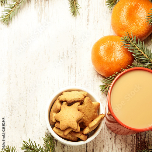 NewYear. Cup of coffee. Delicious tangerines. Spruce branch. Gingerbread Cookie