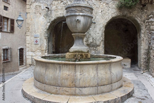 SAINT PAUL DE VENCE, FRANCE - APRIL 24 2017: Big ancient historic fountain in Saint Paul de Vence, France