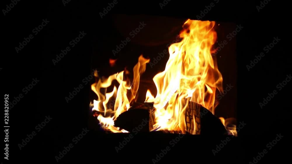 Orange flame in the fireplace. Fire as a beautiful background or backdrop. Orange flame in the fireplace. Fire as a beautiful background or backdrop.