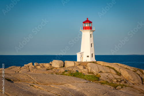 View of Peggy's Cove lighthouse at sunrise, Nova Scotia, Canada photo
