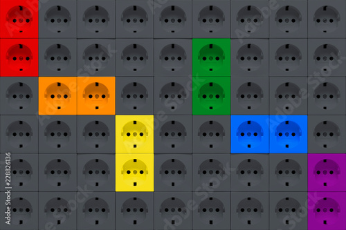 Electrical outlets sockets of gray and rainbow colors photo