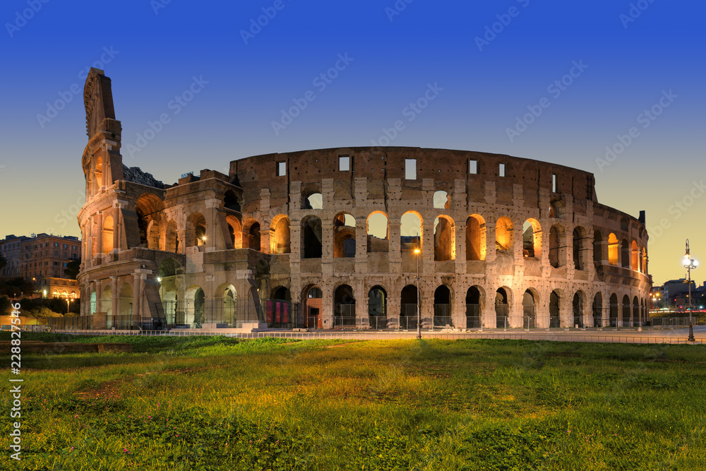 Night view of Colosseum (Coliseum) in Rome before sunrise, Rome, Italy. 
