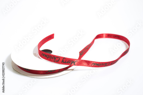 Red christmas ribbon isolated in a white background