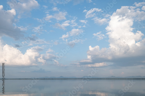 clouds and blue sky over the lake. © narong